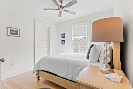 Bright first bedroom w/ closet storage.