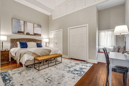 Sink into the king bed in this serene master bedroom w/ layered textures & warm tones.