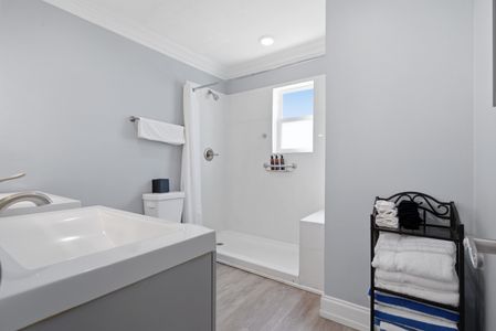 Clean, minimal bath w/ a calming, spa-like feel.
