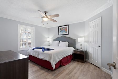 Calm, neutral bedroom w/ a crisp bed ready for deep rest.