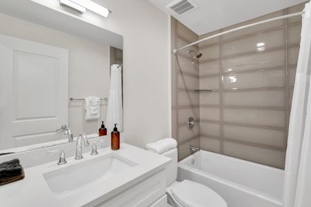 Full bath w/ tub, modern fixtures & fresh linens for a comfortable stay.