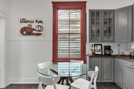 Vibrant dining space w/ bold color & character-filled details.