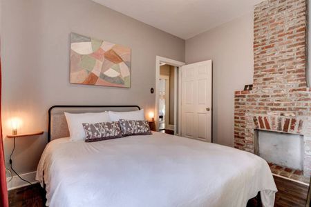Bright second bedroom w/ a plush bed — comfortable space to rest & recharge.