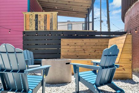 Lively patio w/ Adirondack chairs & a firepit — made for easy NOLA evenings.