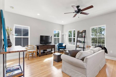 Living room w/ a TV & comfy sofa — great for movie nights in.