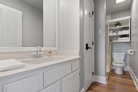 Full bathroom on the second floor w/ sink & clean white finishes.