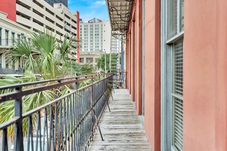 Classic wrought-iron balcony dripping w/ French Quarter character.