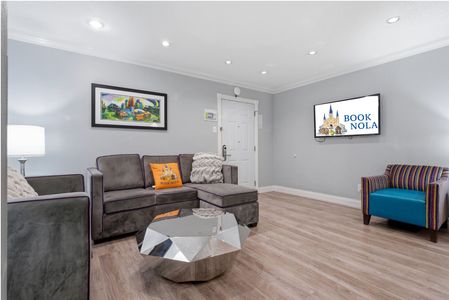 Lounge in style in this modern living space w/ cozy seating & warm accents.