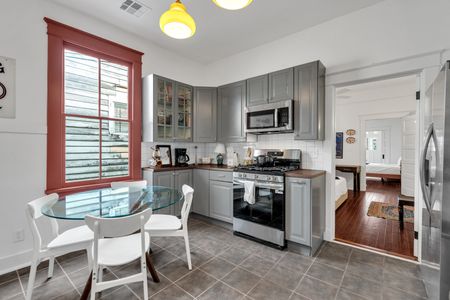 Fully equipped kitchen w/ stainless appliances & generous counter space for home-cooked meals.