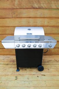 Full-size gas BBQ grill — fired up & ready for your next cookout.