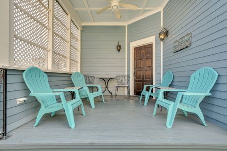 Classic New Orleans porch w/ turquoise chairs made for lazy morning sips.