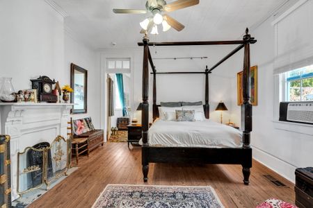 Spacious four-poster king bedroom w/ an airy, serene feel.