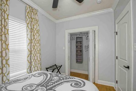 Bedroom w/ smart TV, luggage rack, & closet organization — designed for a stress-free stay.