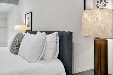 Sink into plush pillows w/ warm, soft lighting for a truly restful night.