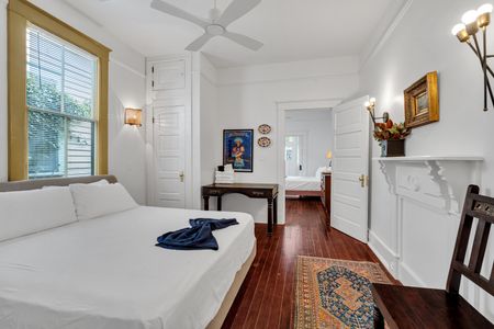 Classic bedroom w/ a clean, timeless feel and a pop of teal.