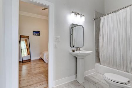 Bathroom vanity w/ sink & mirror — functional & neatly designed for your daily routine.
