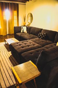 Plush, tufted sectional sofa that pulls you in for a long, lazy afternoon.