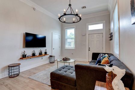 Living area w/ flatscreen TV & comfy seating — settle in and make yourself at home.