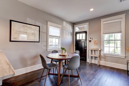 Airy dining nook bathed in natural light — a lovely spot to share a meal.