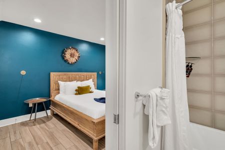 Enjoy easy access to a clean, modern bathroom with plush towels and a bright, polished finish—ideal for refreshing and recharging.