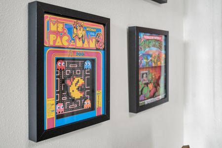 Retro Pac-Man wall art adding a playful, nostalgic touch to the space.