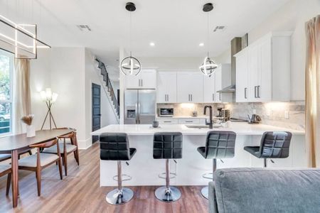 Open kitchen & dining area made for gathering — bright, clean & ready to host.
