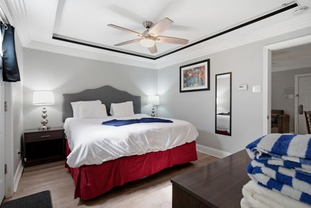Drift off in this calm bedroom w/ a plush bed & soft, neutral tones.