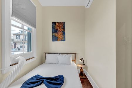 Bright, airy bedroom w/ natural light pouring in for a calm start to your day.