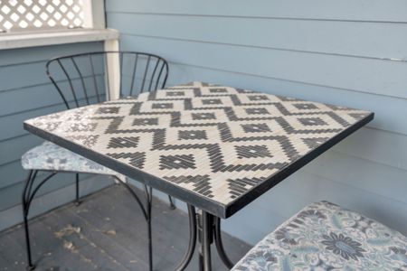 Sip your morning coffee at the porch table surrounded by easy, breezy charm.