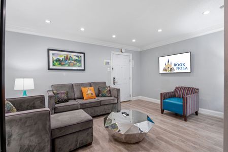 Bright living room w/ plush sofas & warm accents to settle into.