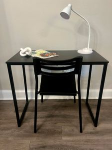 Clean desk setup by the window — get things done in a quiet corner.