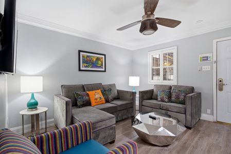 Cozy sitting room w/ plush sofas & natural light pouring in