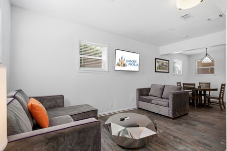 Sun-lit sitting area w/ large windows & comfortable seating to unwind.