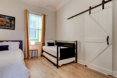 Second bedroom w/ two twin beds & a full — flexible sleeping for any group mix.