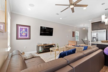 Spacious living room w/ a large sectional — room for everyone to kick back & relax.