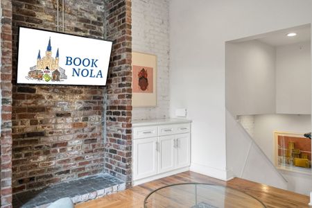 Historic charm meets modern comfort—exposed brick, curated art, and all the essentials for a memorable New Orleans stay.