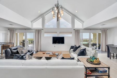 Spacious living room w/ two large sofas, a chaise, & dining for 10.