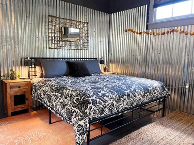 Sink into this king bed dressed in bold floral linens after a long day out.