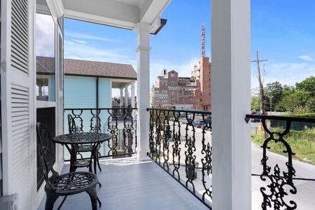 Charming balcony overlooking the street — a perfect spot to soak in the surroundings.