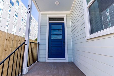 Step out through the bold blue door into the backyard for some sun & fun.