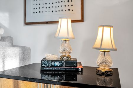 Inviting living area w/ a glowing lamp that sets a warm, relaxed mood.