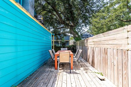 Shaded outdoor patio w/ seating for six — ideal for morning coffee or evening hangs.