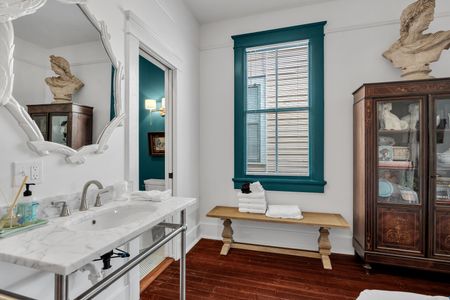 Bathroom vanity stocked w/ fresh linens & plenty of counter space.