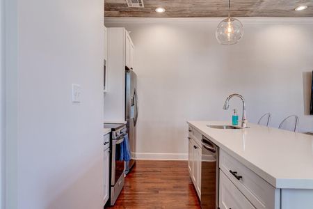 Well-equipped kitchen w/ stainless steel appliances & modern cabinetry.