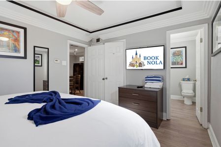 Cozy bedroom corner w/ soft bedding & a calm, neutral palette for easy rest.