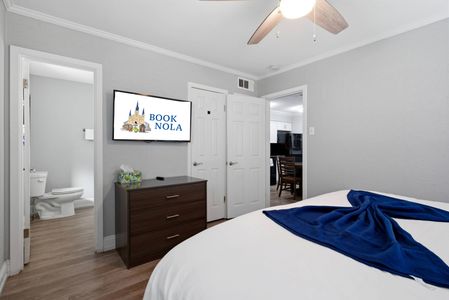 Sun-filled bedroom w/ a comfortable bed & serene atmosphere.