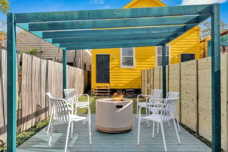 Covered outdoor lounge w/ string lights — your go-to spot day or night.
