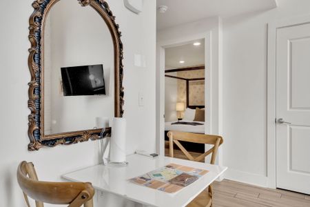 Charming dining nook with vintage flair—perfect for a cozy meal or planning your day in the city.