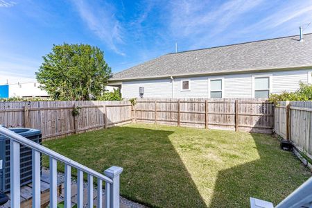 Spacious backyard w/ a lush green lawn — room to breathe & play.