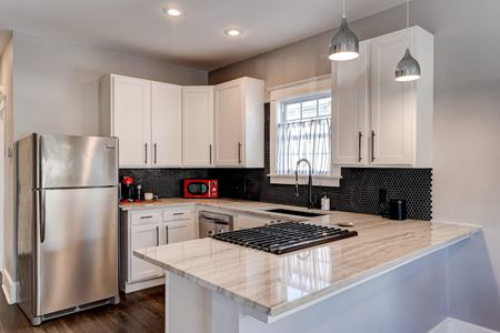 Functional kitchen w/ ample counter space & modern appliances.